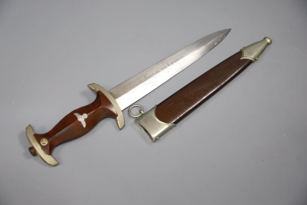 A German WW2 Third Reich SA dagger by Gust. Weyersberg, Solingen, the 22cm blade inscribed Aller Fur Deutschland, with brown nickel mo